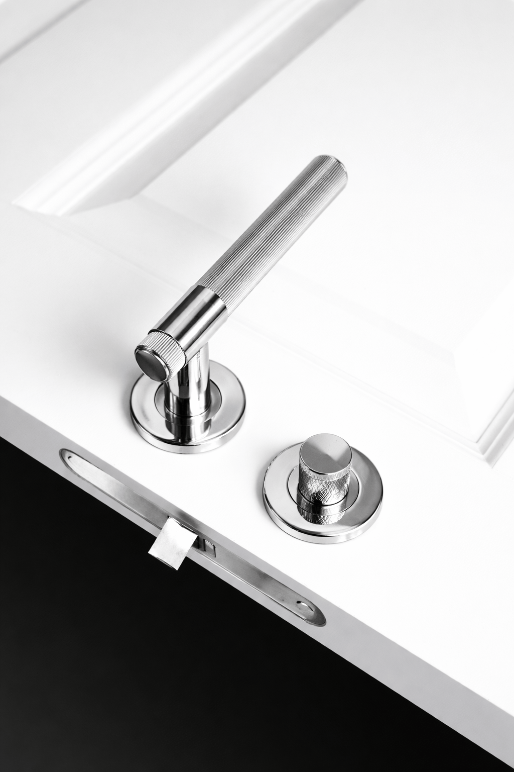 Kingston Reeded | Dørhåndtag i Blank Nikkel Alexander & Wilks AW242PNPVD-SET FINICC